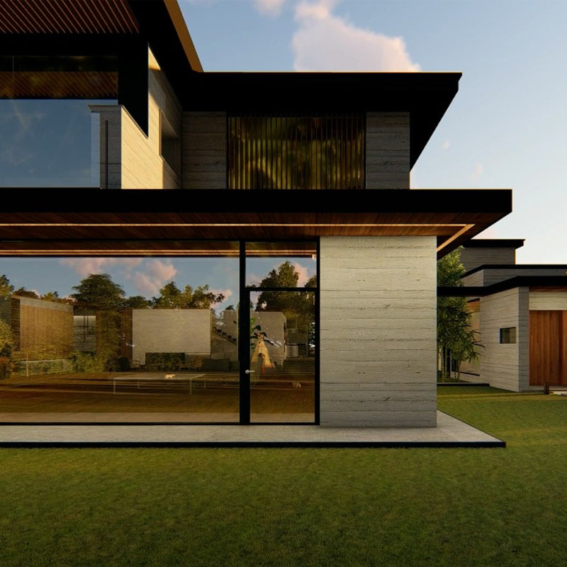 A modern two-storey house with board-formed concrete walls, dark flat roofs and floor-to-ceiling glass beside a lawn