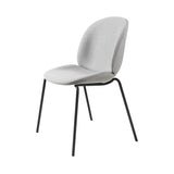 A dining chair with a rounded pale grey fabric shell and four slim black metal legs
