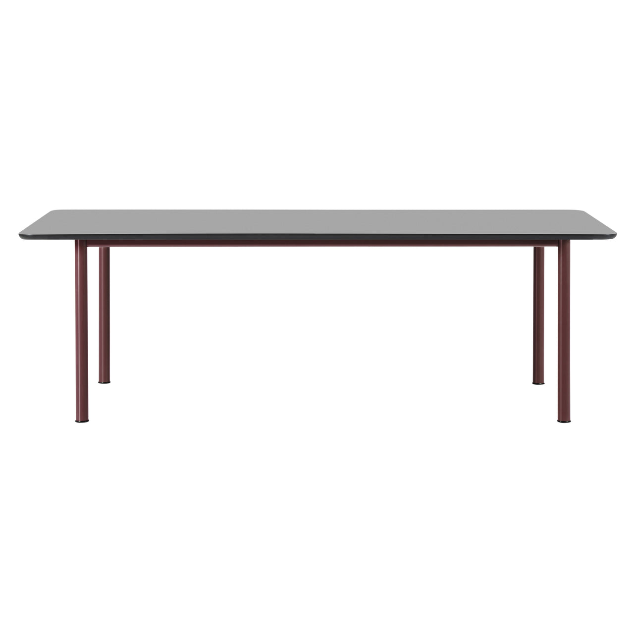 A rectangular table with a grey top and rounded corners on four slim burgundy metal legs