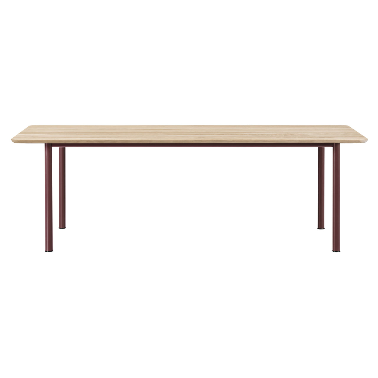 A rectangular table with a light oak top and four slim burgundy metal legs