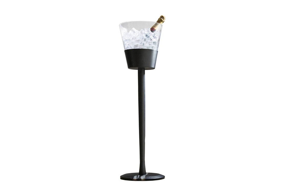 Champagnera bucket in black with champagne and ice against a white background.