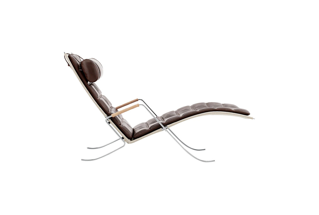 Modern lounge chair with brown leather seat and backrest on a white background