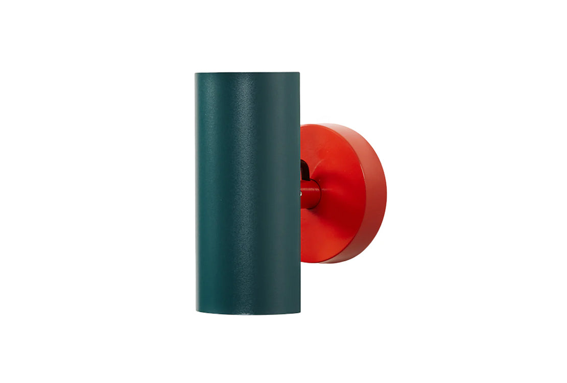 Green cylindrical object with a red circular component on a white background
