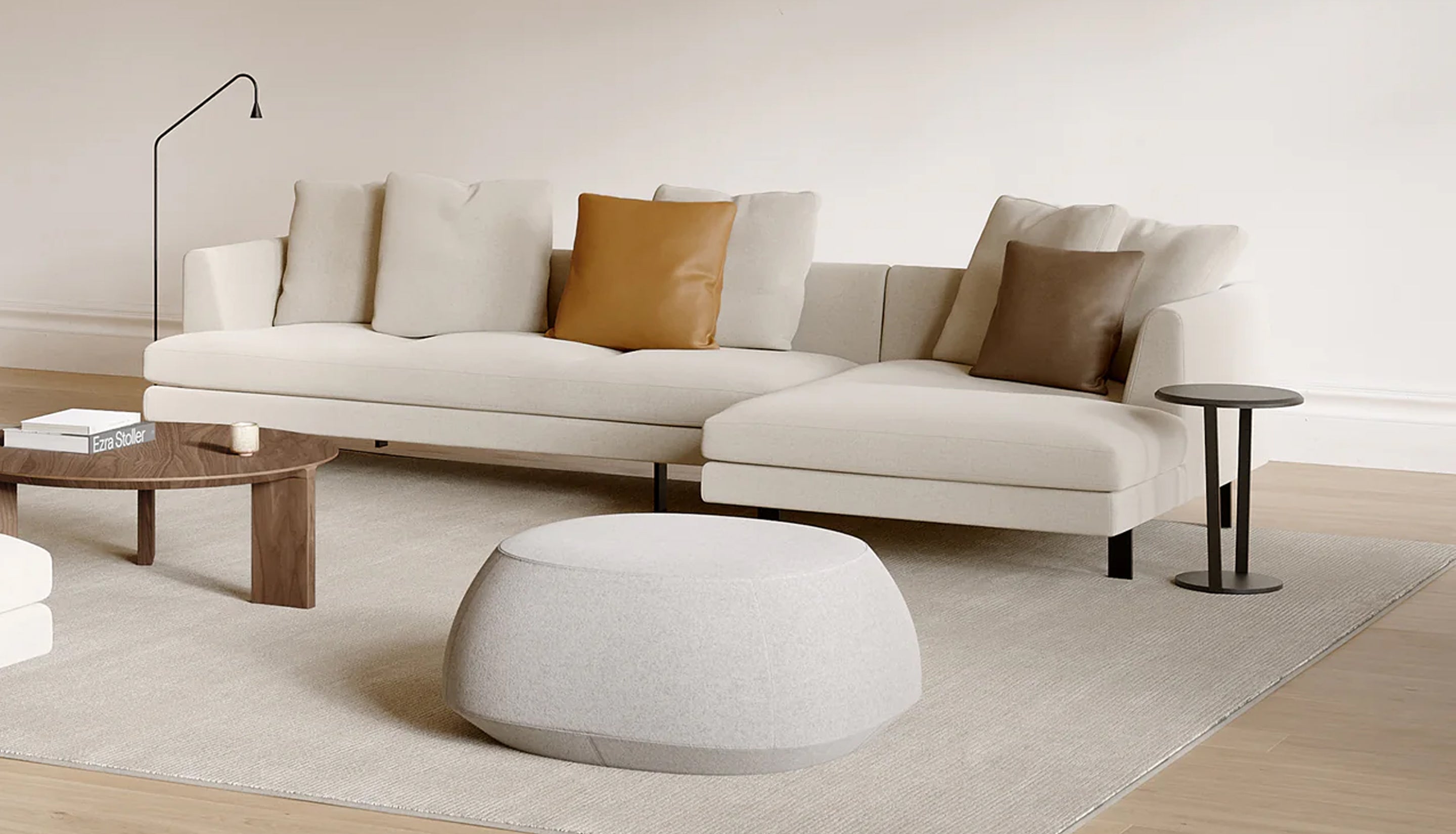 Sofa, coffee table, and pouf in neutral room