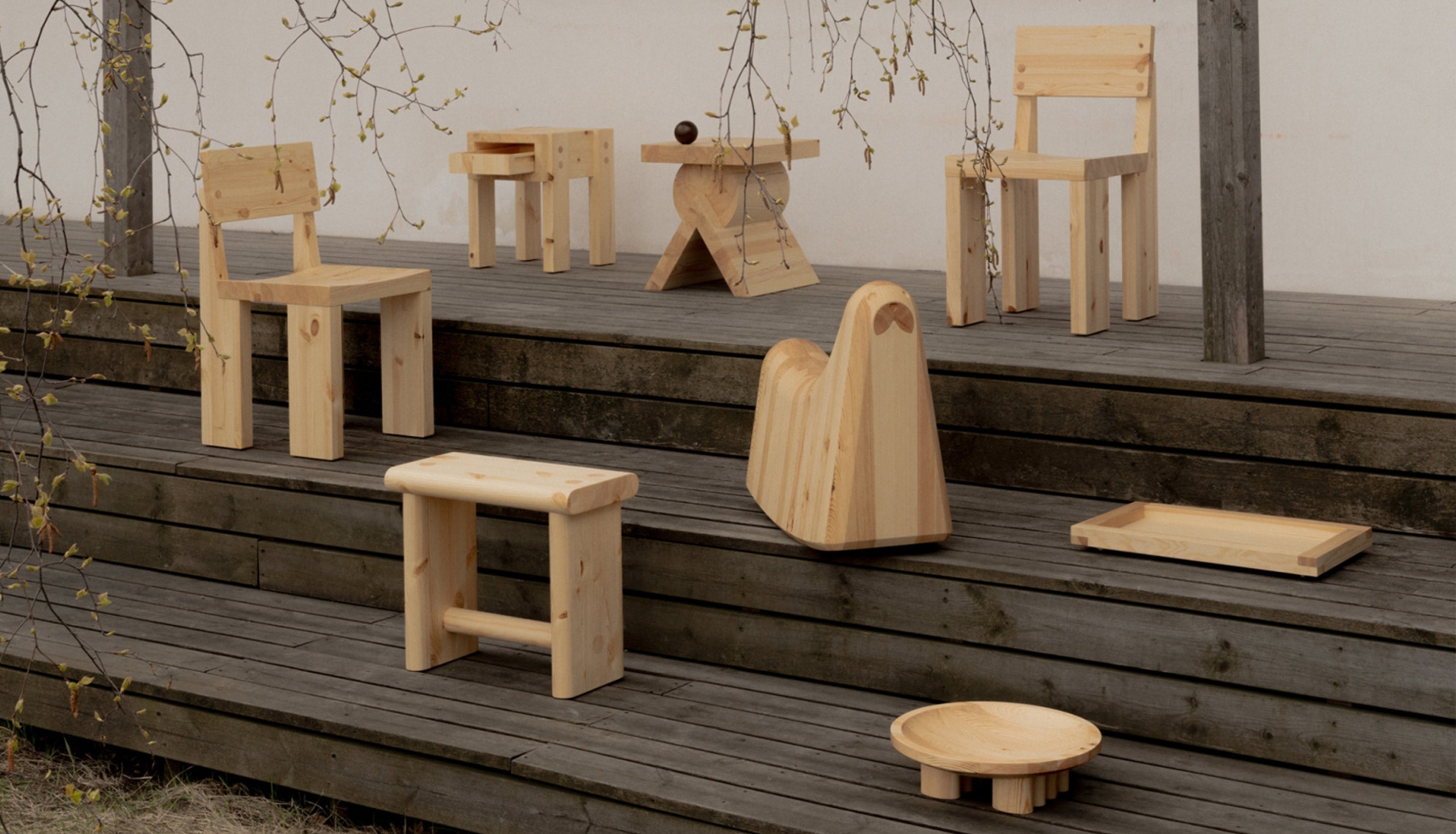 Wooden furniture set on a wooden platform with a natural background
