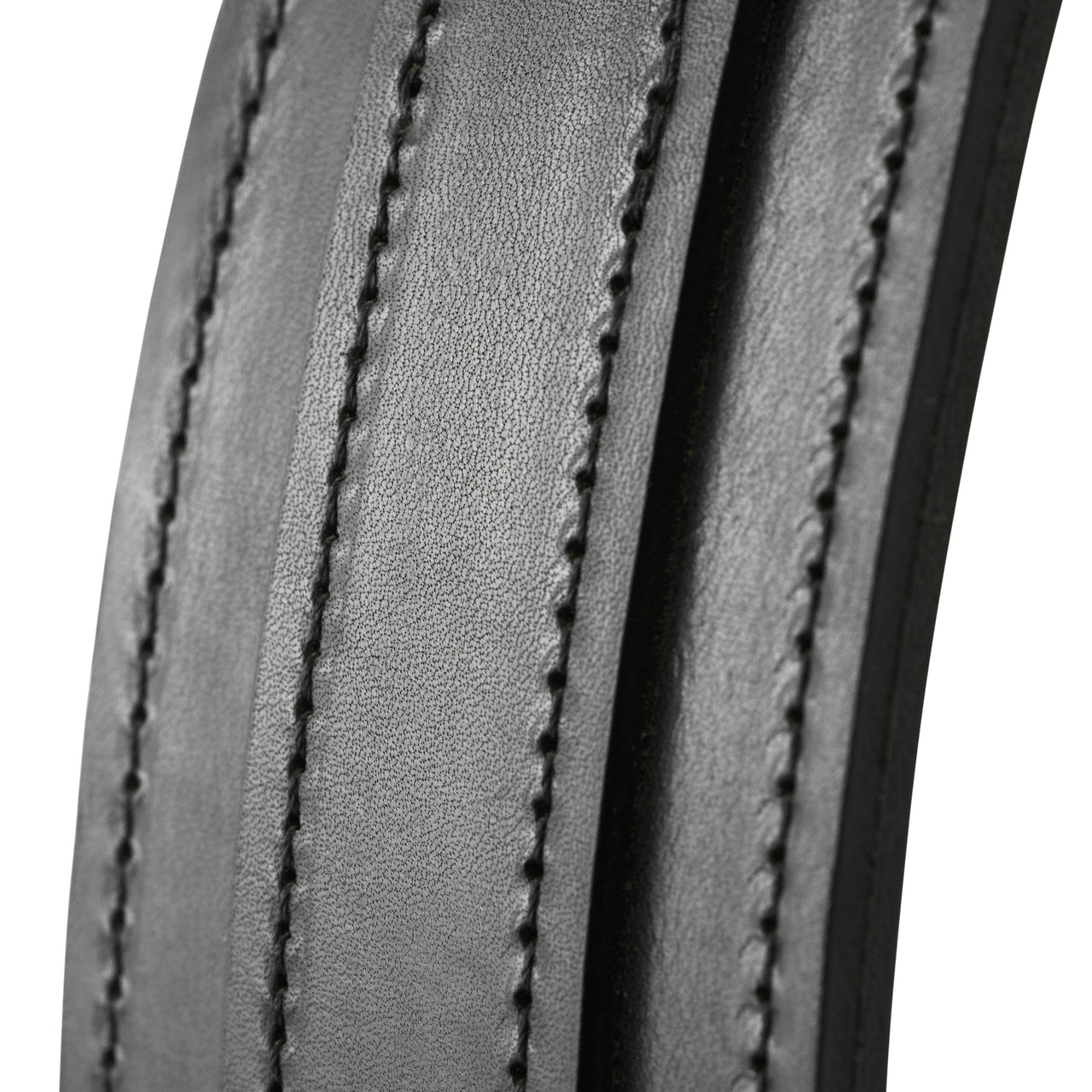 Close-up of a curved grey leather frame with three bands of black contrast stitching