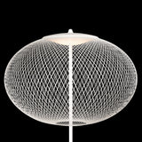 A white floor lamp with a wide oval shade of fine crisscrossing wire, lit from above, on black